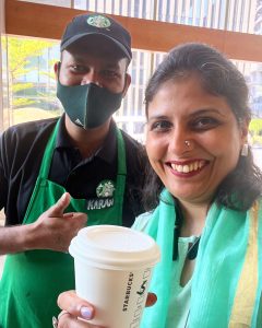With a barista at the Starbucks outlet