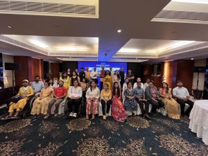 A group photograph of Purple Fest 2024 attendees
